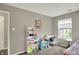 Bedroom showing a desk, shelving, and bright window at 20777 Summitt Rd, Noblesville, IN 46062