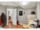 Bedroom or office space with wood flooring and access to the kitchen at 20777 Summitt Rd, Noblesville, IN 46062