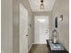 Bright entryway featuring a white front door with decorative glass, neutral walls, and stylish decor at 20777 Summitt Rd, Noblesville, IN 46062