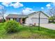 Charming single-story home with a manicured front yard, brick accents, and a spacious two-car garage at 20777 Summitt Rd, Noblesville, IN 46062