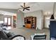 Open-concept living space with plush carpeting, vaulted ceilings, and an adjacent dining and kitchen area at 20777 Summitt Rd, Noblesville, IN 46062