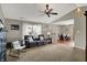 Spacious living room with plush carpeting, gray walls, vaulted ceilings, and an adjacent dining area at 20777 Summitt Rd, Noblesville, IN 46062