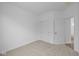 Bedroom with closet and doors, neutral carpeting, and white walls at 2276 Marjorie Way, Shelbyville, IN 46176
