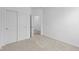 Bedroom with closet and doors, neutral carpeting, and white walls at 2276 Marjorie Way, Shelbyville, IN 46176