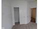 A bedroom with a closet featuring sliding doors and a view to the hallway at 2276 Marjorie Way, Shelbyville, IN 46176