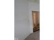 Bedroom interior with a door leading to the ensuite bathroom with modern fixtures at 2276 Marjorie Way, Shelbyville, IN 46176