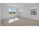 Well lit bedroom with neutral carpeting, paint, and views of the outdoors from multiple windows at 2276 Marjorie Way, Shelbyville, IN 46176
