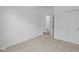 This bedroom has neutral carpet, closet with sliding doors, and a doorway to a bathroom at 2276 Marjorie Way, Shelbyville, IN 46176