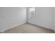Bedroom with carpeting, white walls, and a window providing ample natural light at 2276 Marjorie Way, Shelbyville, IN 46176