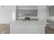 Modern kitchen boasts a large island with quartz countertops, ample cabinet space, and stainless steel appliances at 2276 Marjorie Way, Shelbyville, IN 46176