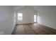 Open living room space with large windows, natural light, and a view of the backyard at 2276 Marjorie Way, Shelbyville, IN 46176