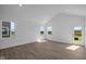 Bright, airy living room with vaulted ceilings, wood-look floors and lots of natural light at 2276 Marjorie Way, Shelbyville, IN 46176