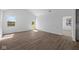 Bright living room offers wood flooring and plenty of natural light, with an entryway to the backyard at 2276 Marjorie Way, Shelbyville, IN 46176