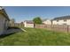 Spacious backyard with a storage shed, mature trees, and a wooden fence, ideal for outdoor activities at 2923 Armaugh Dr, Brownsburg, IN 46112