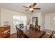 Inviting dining room with dark wood table, chairs, and a ceiling fan for comfortable gatherings at 2923 Armaugh Dr, Brownsburg, IN 46112