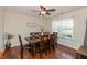 Cozy dining room area featuring a wooden table, chairs, and ample natural light from the window at 2923 Armaugh Dr, Brownsburg, IN 46112