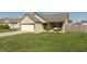 Lovely home with a well-maintained lawn and cozy porch swing for relaxing outdoors at 2923 Armaugh Dr, Brownsburg, IN 46112
