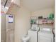 Functional laundry area featuring a washer, dryer, shelving and ample storage space at 2923 Armaugh Dr, Brownsburg, IN 46112