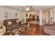 Inviting living room with hardwood floors, comfortable seating, and a seamless flow to the kitchen at 2923 Armaugh Dr, Brownsburg, IN 46112