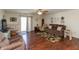 Bright and airy living space with hardwood floors and sliding glass doors to the backyard at 2923 Armaugh Dr, Brownsburg, IN 46112