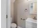 Half bathroom featuring a white vanity, toilet, and neutral wall color at 2935 Highland Pl, Indianapolis, IN 46208