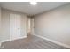 Carpeted bedroom with white painted doors and trim complemented by neutral walls and natural lighting at 2935 Highland Pl, Indianapolis, IN 46208