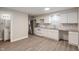 Kitchen featuring white cabinets, stainless steel appliances, and a dining area at 2935 Highland Pl, Indianapolis, IN 46208
