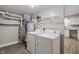 Bright laundry room with modern washer and dryer units and updated mechanicals on display at 2935 Highland Pl, Indianapolis, IN 46208