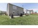Spacious backyard featuring a patio and wooden deck, perfect for outdoor entertaining at 3189 Underwood Dr, Whiteland, IN 46184