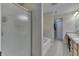 Bathroom featuring a shower with a glass door, a bathtub, double sinks, and wood cabinetry at 3189 Underwood Dr, Whiteland, IN 46184