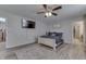 Spacious bedroom with a ceiling fan, neutral color palette, comfortable furnishings, and a cozy rug at 3189 Underwood Dr, Whiteland, IN 46184