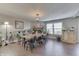 Bright dining area features a large table, stone fireplace and hardwood floors at 3189 Underwood Dr, Whiteland, IN 46184