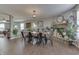 Open-concept dining area with fireplace, hardwood floors and neutral paint at 3189 Underwood Dr, Whiteland, IN 46184