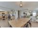 Hardwood floors and natural light in an open-concept dining area flows into the kitchen at 3189 Underwood Dr, Whiteland, IN 46184