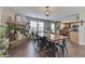 Cozy dining area with large table, stone fireplace and decorative plants at 3189 Underwood Dr, Whiteland, IN 46184
