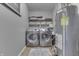 Laundry room features updated washer and dryer and shelving space at 3189 Underwood Dr, Whiteland, IN 46184