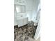 Bright bathroom featuring a modern vanity, toilet, and eye catching flooring at 3532 E 10Th St, Indianapolis, IN 46201