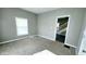 Cozy bedroom with neutral paint, plush carpet, and natural light at 3532 E 10Th St, Indianapolis, IN 46201