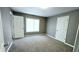 Neutral bedroom with ample lighting and plush carpet at 3532 E 10Th St, Indianapolis, IN 46201