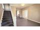 Inviting entryway featuring staircase and view into other rooms at 3532 E 10Th St, Indianapolis, IN 46201