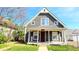 Charming home with a cozy front porch and well-lit windows at 3532 E 10Th St, Indianapolis, IN 46201