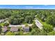 Aerial shot showcases a neighborhood surrounded by green trees and well-maintained roadways at 3611 Owster Ln, Indianapolis, IN 46237