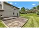 Lush backyard with a patio, mature trees, and green grass, perfect for entertaining and relaxing at 3611 Owster Ln, Indianapolis, IN 46237