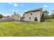 Spacious backyard showcasing a well-maintained lawn, and an outdoor living space at 3611 Owster Ln, Indianapolis, IN 46237