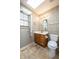 Bathroom featuring a vanity with wooden cabinets, plus a skylight at 3611 Owster Ln, Indianapolis, IN 46237