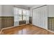 Bright bedroom with wood floors, large window, and closet space at 3611 Owster Ln, Indianapolis, IN 46237