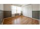 This cozy bedroom features a beautiful hardwood floor, decorative wall trim and a large closet at 3611 Owster Ln, Indianapolis, IN 46237