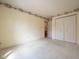Empty bedroom with wall-to-wall carpet, trim at ceiling and closet at 3611 Owster Ln, Indianapolis, IN 46237