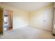 Bedroom featuring wall-to-wall carpet and door to hall or bathroom at 3611 Owster Ln, Indianapolis, IN 46237