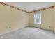 Bedroom with natural light from window and neutral carpeting at 3611 Owster Ln, Indianapolis, IN 46237